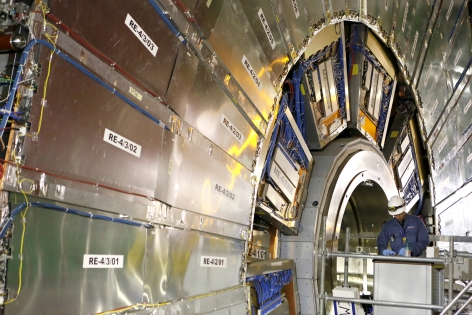  A technician works in the Compact Muon Solenoid(CMS) experiment during a media visit at the Organization for Nuclear Research (CERN) in the French village of Cessy near Geneva in Switzerland, July 23, 2014. The Large Hadron Collider (LHC), the largest and most powerful particle accelerator in the world, has started to get ready for its second three-year run starting in early 2015.  Over the last 16 months, the LHC and its experiments (CMS, ALICE, ATLAS and LHCb) have been through a major program of maintenance and upgrading. Some 10,000 superconducting magnet interconnections of were consolidated in order to prepare the LHC machine for running at its design energy. REUTERS/Pierre Albouy (FRANCE)